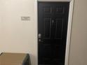 Contemporary black front door featuring a sleek design, modern hardware, and a clearly marked address number at 239 Longview Ave # 107, Celebration, FL 34747