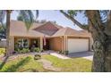 Single Gathering home featuring a two-car garage and front yard with decorative rock landscaping at 3738 Crossing Creek Blvd, St Cloud, FL 34772