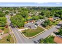 Aerial view of a home nestled among lush greenery in a residential neighborhood at 6824 Chaucer Ln, Orlando, FL 32809