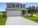 Beautiful two-story home with a spacious garage and well-maintained landscaping at 819 Lake Dell Rd, Dundee, FL 33838