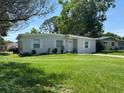 Welcoming single-story home with freshly cut green lawn and inviting curb appeal at 921 Alecon Dr, Orlando, FL 32808