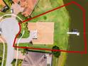 Aerial view showcases the home's expansive lot and waterfront access, featuring a private boat dock at 1110 Terralago Way, Kissimmee, FL 34746