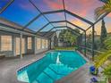 Relaxing screened-in pool area features a sparkling pool and ample deck space perfect for outdoor enjoyment at 12445 Bohannon Blvd, Orlando, FL 32824