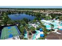 Resort-style community featuring a lake, lazy river, swimming pool, basketball court and lush tropical landscaping at 1614 Lima Ave, Kissimmee, FL 34747