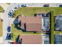 Aerial shot of a home with an enclosed pool, showing the property's layout and neighborhood at 307 Fox Loop, Davenport, FL 33837