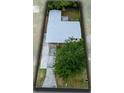 Aerial view of the property showcasing the roof, yard, driveway, and surrounding neighborhood at 512 Maryland Ave, St Cloud, FL 34769