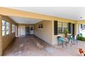 Large carport area with ample parking and access to the home's entrance, enhanced with outdoor seating at 512 Maryland Ave, St Cloud, FL 34769