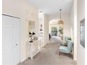 Hallway with carpet flooring, light walls, and modern decor that leads to other rooms at 607 Gran Bahama Blvd # B29/U607, Davenport, FL 33897