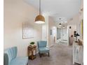 Hallway features neutral walls, carpeted flooring, and decorative light fixtures at 607 Gran Bahama Blvd # B29/U607, Davenport, FL 33897
