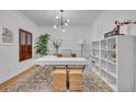 Bright office featuring white walls, modern lighting, and stylish white desk at 6970 Piazza St, Orlando, FL 32819