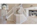 Spacious entryway featuring a grand staircase, tile flooring, and plenty of natural light at 12303 Bohannon Blvd, Orlando, FL 32824