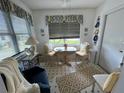 Cozy breakfast nook with a window, comfortable seating, and a charming decorative arrangement at 1410 Sanchez Ct, Lady Lake, FL 32159