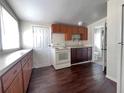 An efficient kitchen with appliances and access to a bathroom at 1413 11Th St, St Cloud, FL 34769