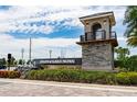 Isles of Lake Nona entrance sign with stone base, water feature, and lush landscaping under sunny skies at 14416 Orchid Island Dr, Orlando, FL 32827