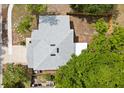 Aerial view of house showing new grey roof with skylights and fenced in backyard at 2421 Deermeadow Dr, Apopka, FL 32703