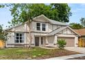 Charming two-story home featuring neutral paint, attached two car garage, and well-maintained lawn at 2421 Deermeadow Dr, Apopka, FL 32703