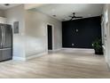 Open-concept living area featuring new flooring and a modern ceiling fan at 2453 Sipes Ave, Sanford, FL 32771