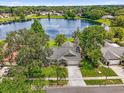 Beautiful aerial shot of a well kept single story home, mature trees, with gorgeous lake views at 248 Country Landing Blvd, Apopka, FL 32703