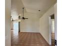 Spacious living room featuring tile flooring and a ceiling fan at 260 Piccolo Way, Davenport, FL 33896