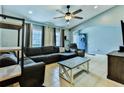 Spacious living room with large sectional sofa and bright natural lighting at 330 Chiquita Ct, Kissimmee, FL 34758