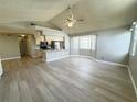 Open-concept living and dining area featuring modern, light-colored flooring and plenty of natural light at 5017 Laguna Bay Cir # 96, Kissimmee, FL 34746