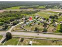 Property in residential neighborhood with proximity to a major highway, featuring scenic green spaces at 6006 Country Walk Ln, Winter Haven, FL 33880