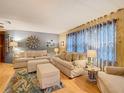 Cozy living room with comfortable sofas, soft lighting, and inviting decor at 6044 Grand Oaks Se Dr, Winter Haven, FL 33884