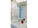 Bright bathroom with a decorative mirror, stylish sink, and whimsical accents for a fun touch at 726 Longboat, Davenport, FL 33896