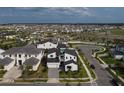 Beautiful aerial view of a modern home in a well-planned community with lush landscaping at 9004 Santorini Dr, Orlando, FL 32827