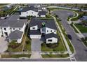 A well-manicured lawn and paved driveway complement this charming two-story home at 9004 Santorini Dr, Orlando, FL 32827