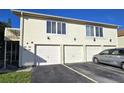 Well-maintained condo building with individual garages and clearly marked unit numbers at 1024 Spring Meadow Dr, Kissimmee, FL 34741