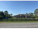 Charming one-story home with a well-maintained lawn and black wooden fence at 18805 Nettleton St, Orlando, FL 32833