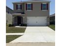 Charming two-story home featuring a spacious two car garage, neutral colors and a well-maintained lawn at 3673 Caspian St, Leesburg, FL 34748