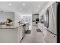Modern kitchen boasting stainless steel appliances, sleek countertops, and seamless design at 3844 Cabo Rojo Dr, St Cloud, FL 34772