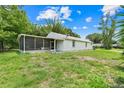 This home features a screened in lanai and spacious backyard at 429 Diamond Acres Rd, Davenport, FL 33837