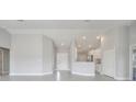 Spacious living room features recessed lights, neutral paint, and tile flooring at 563 Viceroy Ct, Kissimmee, FL 34758