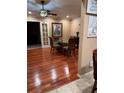 Elegant dining room featuring wood floors, modern lighting, and classic decor at 878 Elgin Dr, Winter Springs, FL 32708
