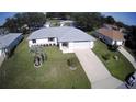 Aerial shot of home with manicured lawn and mature landscaping at 10237 Sw 63Rd Ave, Ocala, FL 34476