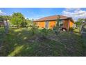 Spacious backyard with green lawn perfect for outdoor activities at 1107 Dartford Dr, Kissimmee, FL 34758