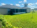 Expansive backyard with a screened lanai, offering privacy and outdoor enjoyment at 236 Rontunda Dr, Kissimmee, FL 34758
