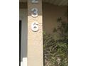 Close-up of the house number (236) on a neutral-colored exterior at 236 Rontunda Dr, Kissimmee, FL 34758