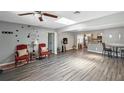 Inviting living room with wood floors, skylight, and easy access to the kitchen at 4218 Drexel Ave, Orlando, FL 32808
