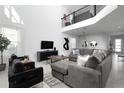 Bright living room featuring modern decor, comfortable seating, and lots of natural light at 4290 Paragraph Dr, Kissimmee, FL 34746