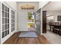 Inviting home foyer featuring wood floors and an open doorway to the front yard at 501 Pheasant Dr, Haines City, FL 33844
