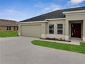 Charming single-Gathering home with an attached two-car garage and well-kept landscaping at 555 Viceroy Ct, Kissimmee, FL 34758