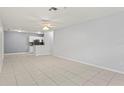 Bright and spacious living room with tile flooring and an open concept design at 6548 Swissco Dr # 61, Orlando, FL 32822