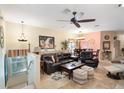Inviting living room with comfortable seating, stylish decor, and bright natural light at 7521 Pellham Way, Kissimmee, FL 34747