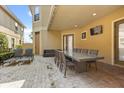 Open patio features stone floors, an outdoor table, chairs, and lounge seating at 781 Golden Bear Dr, Kissimmee, FL 34747