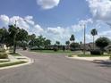 The community features well-manicured lawns, mature trees, and inviting common areas, perfect for relaxed living at 88 Club Villas Ln, Kissimmee, FL 34744