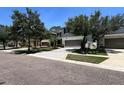 Well-maintained two-story home with neutral colors, a two-car garage, and mature landscaping in a desirable neighborhood at 1043 Tourmaline Dr, Kissimmee, FL 34746